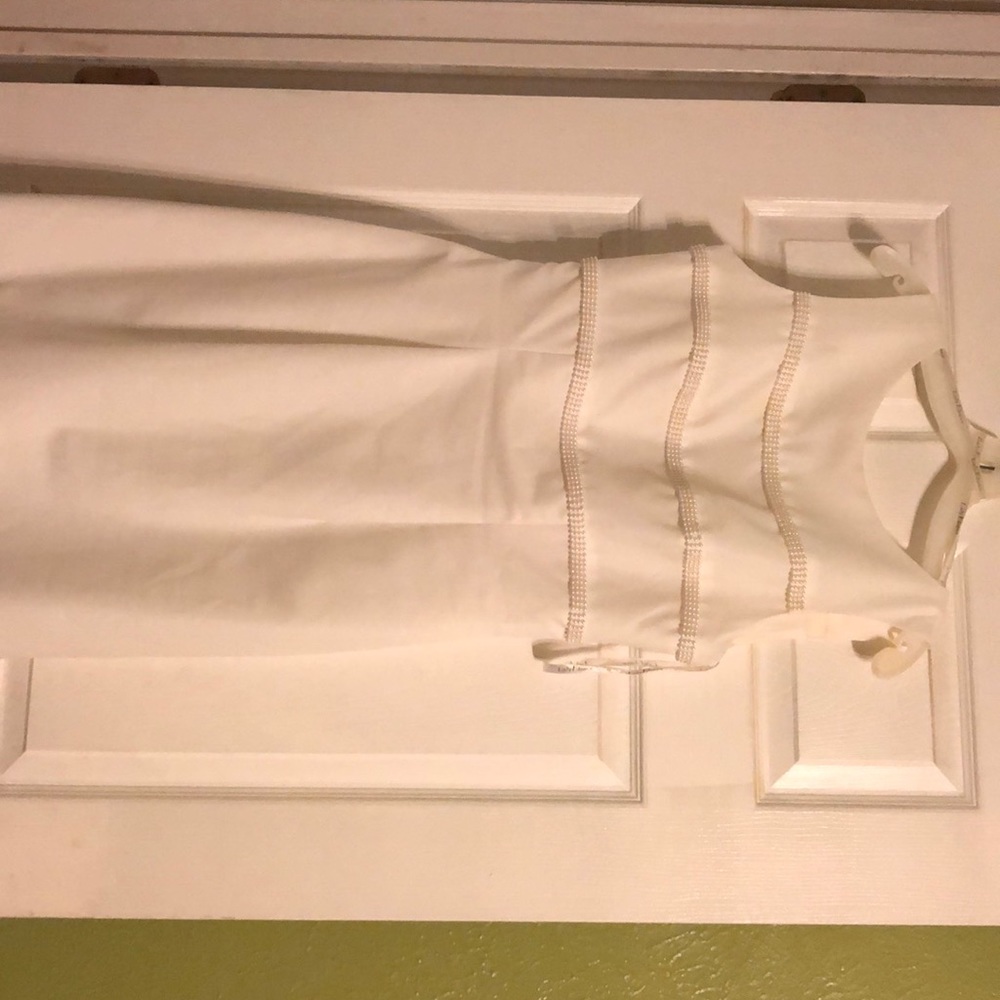 Wedding dress pearl application / David’s Bridal